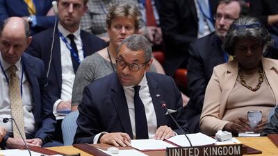Britain's Foreign Secretary James Cleverly watches Mr Lavrov walk out while he is speaking. AP Photo
