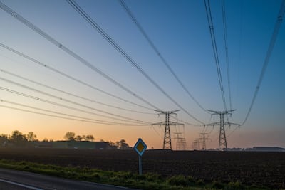 Electricity pylons and power lines near the Paluel nuclear power plant in France. Bloomberg