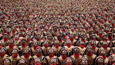 People taking part in the traditional Saman dance which originates from the Gayo ethnic group in Gayo Lues District, Aceh province, Indonesia on August 13, 2017. Antara Foto/Irwansyah Putra via Reuters