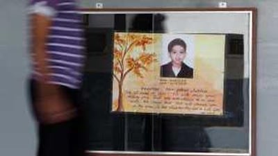 A showcase displays a memorial to Ashton Saldanha at Emirates English Speaking School in Dubai.