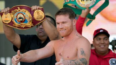 Saul Alvarez motions to the crowd during the weigh-in for his fight against Dmitry Bivol. AP