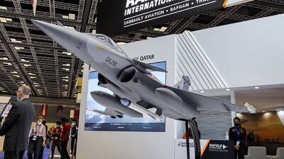 A one-fifth scale model of a Qatar Emiri Air Force French-made Dassault Rafale multi-role fighter aircraft at the Doha International Maritime Defence Exhibition in the Qatari capital.
