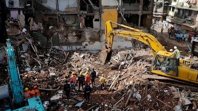 Firefighters and rescue workers search for survivors at the site of a collapsed building in Mumbai, India on September 1, 2017. Shailesh Andrade / Reuters