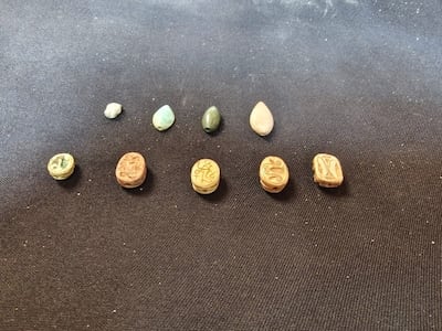 A selection of scarab and bead elements from the tomb. Photo: Egyptian Ministry of Tourism and Antiquities