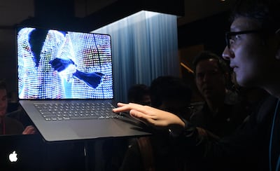 An attendee looks at the new M6 14-inch MacBook Pro during the Apple Experience LA event in Los Angeles, on October 28, 2026. (Photo by Frederic J. Brown / AFP)
