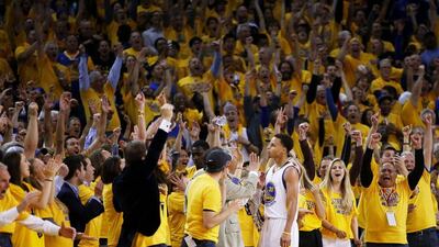 Fans react after Stephen Curry of the Golden State Warriors makes a shot in their Game 1 win over the Houston Rockets on Tuesday night. Ezra Shaw / Getty Images / AFP / May 19, 2015