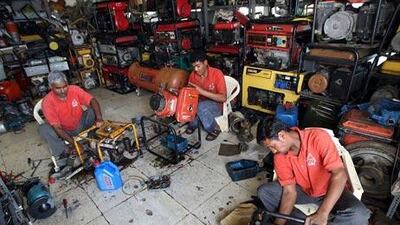 Manazil staff prepare generators for hire.