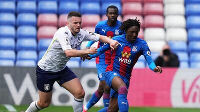 Eberechi Eze of Crystal Palace is challenged by John McGinn of Aston Villa. Getty