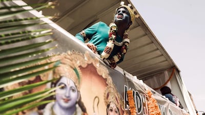 A young Hindu devotee looks on during a street parade as part of the preparations of the two-days celebrations for the Diwali Hindu festival (Festival of Lights) at the old Drive-Inn in Durban, on October 19, 2019. The two-day festival attracts over 100,000 visitors. The festival celebrations include, parading of floats, chariots, singing of devotional songs, dances, games, face painting, food stalls of vegetarian food, clothing, display of toys and jewellery. YAFP