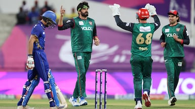 Desert Vipers' Usman Tariq, centre, celebrates the wicket of Sanjay Krishnamurthi of MI Emirates during Qualifier 1 of the DP World International League T20. ILT20