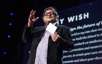 Sugata Mitra collects at a TED talk award in California in 2013. AFP
