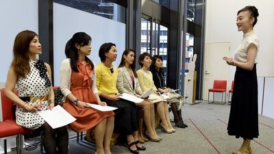 Madame Yumiko of the Japan High Heel Association gives a lesson in how to walk in high heels on April 27, 2016. Toshifumi Kitamura / Agence France-Presse