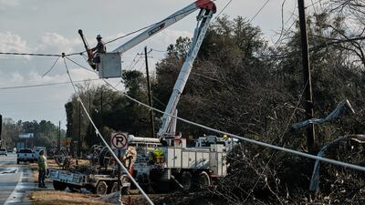 Emergency crews work on downed power lines in Mount Vernon. EPA