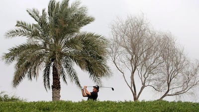 Phil Mickelson takes a shot during his round on Sunday. Ali Haider / EPA