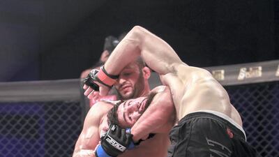 Brave Combat Federation 27 at the Mubadala Arena. Welterweight: (R-L) Abdoul Abdouraguimov (FRA) gets choked by Jarrah Al Selawe (JOR) during the main event. Victor Besa / The National