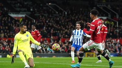 Manchester United's Jadon Sancho sees a first-half shot saved by Brighton goalkeeper Robert Sanchez. PA