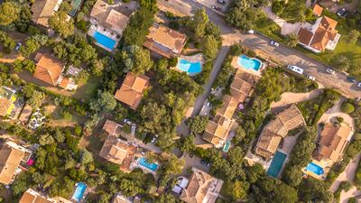Because swimming pools boost property values, they usually lead to higher property and residency taxes. Getty Images