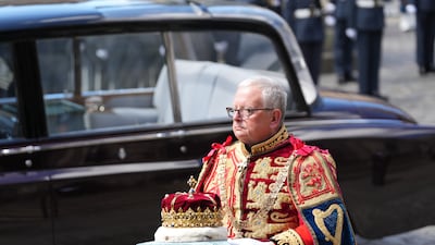 Lord Lyon King of Arms, Joseph Morrow, carrying the crown, which forms part of the Honours of Scotland, into St Giles' Cathedral. PA