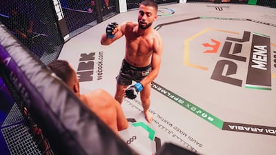 Abdullah Al Qahtani goes to work on Yazeed Hasanain.