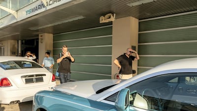 The first set of drivers overlook the cars. Courtesy Abu Dhabi Motors