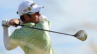 Louis Oosthuizen admires his drive from the sixth tee during his second round yesterday. He will partner Paul Casey today.