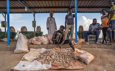 Workers crush ore containing gold at a small-scale gold milling operation outside Atbara, Sudan. Bloomberg via Getty Images