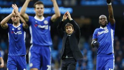 Chelsea manager Antonio Conte and players applaud fans after a match on December 3, 2016. Jason Cairnduff / Reuters