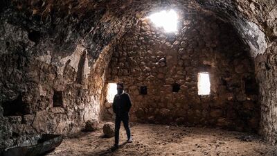 A boy walks inside the dilapidated Ezekiel synagogue, in Shush, northern Iraq.