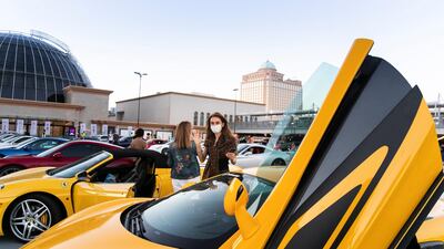 The drive-in cinema is making a comeback at Mall Of The Emirates, and a large screen has been assembled in the shopping centre's upper parking lot, on level 3, right underneath Ski Dubai's slope. Patrons take position, switch off their engines and settle in for the film. These photos were all taken on the launch night, on Wednesday, May 13. Reem Mohammed / The National