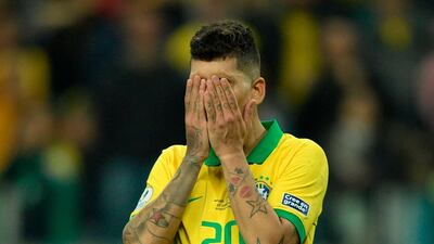 Brazil's Roberto Firmino reacts after missing his penalty by sending the ball wide in the penalty shoot-out. AFP