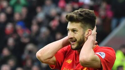 Liverpool's English midfielder Adam Lallana reacts after a missed chance against Swansea City at Anfield in Liverpool, north west England on January 21, 2017. Anthony Devlin / AFP