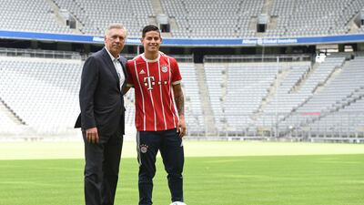 Colombian midfielder James Rodriguez presents his new match jersey with Bayern Munich coach Carlo Ancelotti in Munich, Germany July 12, 2017. REUTERS/Andreas Gebert