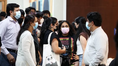 Pupils and their parents arriving to receive their IB results.