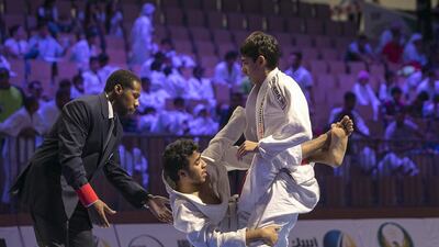 Magomed Magomedvaliev Ibraghimovich, right, fights Ahmed Rashed Alkaabi during the male white teen 58.5Kg division competition during the 2015 Abu Dhabi World Children’s Cup, April 21, 2015, at the IPIC Arena in Abu Dhabi. Silvia Razgova / The National
