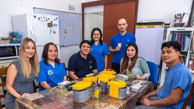 Staff at the British Veterinary Centre now order their lunch in reusable kits to avoid plastic waste Victor Besa/The National