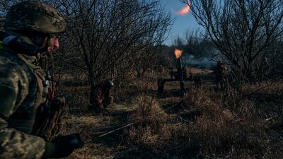 Ukrainian soldiers fire at Russian positions at the frontline near Bakhmut in the Donetsk region. AP