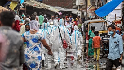 Indian health workers wearing personal protective equipment in Mumbai, India. EPA