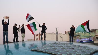 People in Tehran celebrate after Iran launched missiles at an Iraqi base housing US forces. WANA