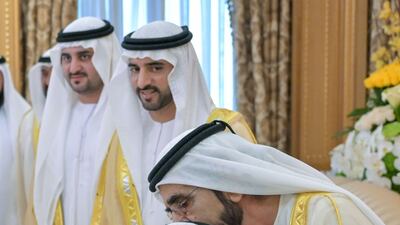 The Ruler of Dubai greets a young visitor