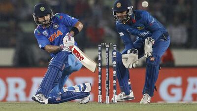 Virat Kohli, left, will lead India against Sri Lanka. AM Ahad / AP Photo