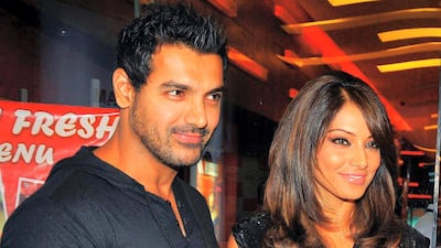 Abraham and former girlfriend Bipasha Basu at a screening of the Hindi film ' Pankh' in Mumbai in 2010. AFP Photo.