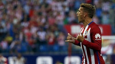 Atletico Madrid's Antoine Griezmann celebrates scoring his team's lone goal in a 1-0 La Liga victory over Las Palmas on Saturday night. Sergio Perez / Reuters / August 22, 2015