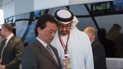 Sheikh Mohammed bin Zayed, Crown Prince of Abu Dhabi and Deputy Supreme Commander of the Armed Forces, right, and Prince Abdullah bin Sultan Ahmad Shah, Crown Prince of Pahang, left, attend the final day of the 2014 Formula 1 Etihad Airways Abu Dhabi Grand Prix at Yas Marina Circuit. Ryan Carter / Crown Prince Court — Abu Dhabi