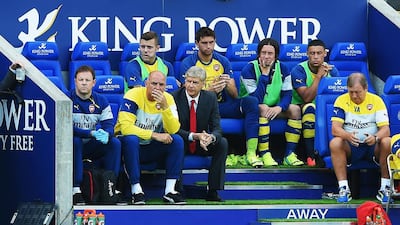 Arsene Wenger, manager of Arsenal sits in the dug out with assistant Steve Bould during their English Premier League match at Leicester City. Wenger's approach in the transfer window lacked the aggression Jose Mourinho displayed in grabbing Loic Remy from under Arsenal's noses and bringing him to Chelsea. Michael Regan / Getty Images