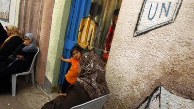 Palestinian refugees hold a sit-in outside the offices of the United Nations Relief and Works Agency (UNRWA) in Gaza city. Mohammed Abed / AFP