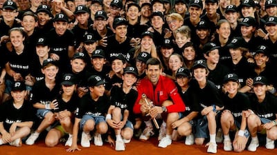 Serbian tennis player Novak Djokovic (C) celebrates with the winner’s trophy his victory 6-2, 3-6 and 6-3 against Scottish Andy Murray during their Madrid Masters male final match played at the Caja Magica tennis complex in Madrid, Spain, on 08 May 2016. Juanjo Martin / EPA