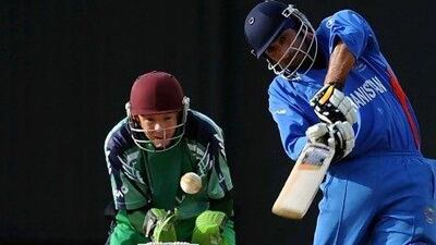Niall O'Brien, left, of Ireland, watches as Afghanistan's Asghar Stanikzai plays in a warm-up match two years ago. Both sides have aggressive players capable of beating bigger teams in Twenty20 cricket. Indranil Muherjee / AFP
