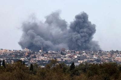 Smoke rises into the sky above Khan Younis after Israel bombs were dropped in the southern Gaza Strip. AFP