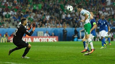 Robbie Brady connects with the header that earned Ireland a 1-0 win against Italy and ensured their place in the Euro 2016 knockout stages. Mike Hewitt / Getty Images)