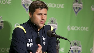 Tottenham Hotspur manager Mauricio Pochettino addresses media after his side's 3-3 draw with MLS side Seattle Sounders on Saturday. Stephen Brashear / AP / July 19, 2014